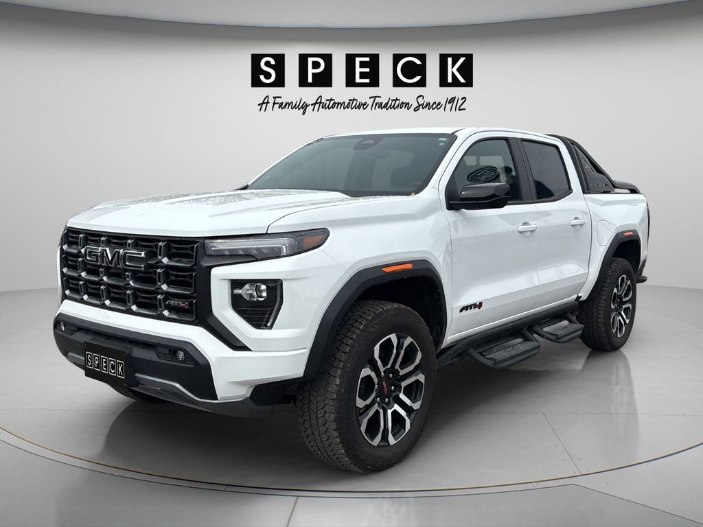 2025 GMC Canyon 4WD AT4 in Summit White — front three-quarter view