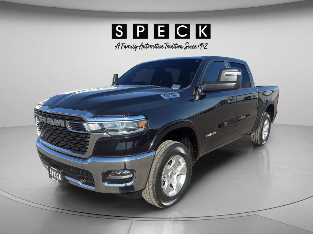 2025 RAM 1500 Big Horn Crew Cab 4x4 5'7' Box in Diamond Black Crystal Pearlcoat — front three-quarter view