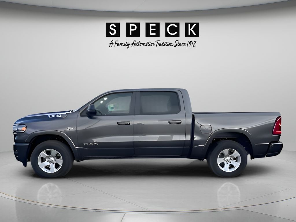 2026 RAM Ram 1500 RAM 1500 BIG HORN CREW CAB 4X4 5'7' BOX in Granite Crystal Metallic Clear-Coat Exterior Paint — front three-quarter view