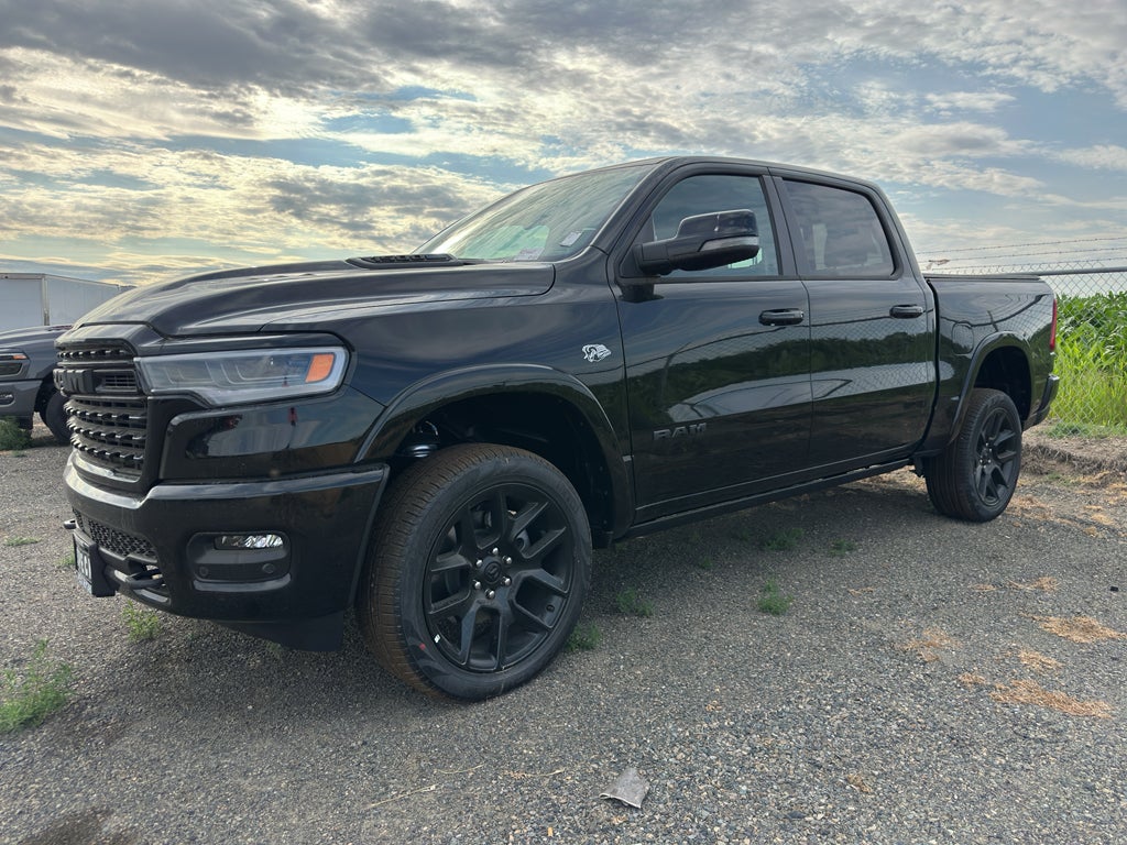 2026 RAM Ram 1500 RAM 1500 LIMITED CREW CAB 4X4 5'7' BOX in Diamond Black Crystal Pearl-Coat Exterior Paint — front three-quarter view