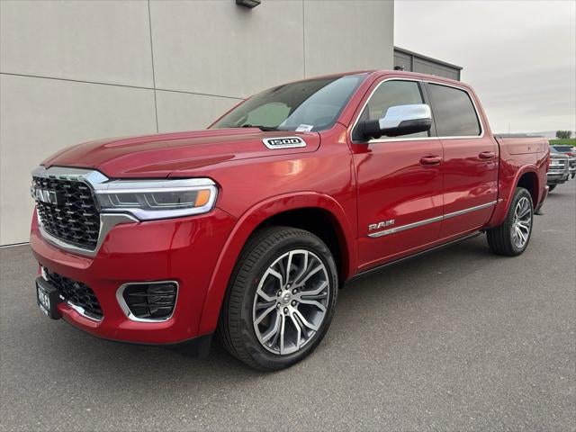 2026 RAM Ram 1500 RAM 1500 TUNGSTEN CREW CAB 4X4 in Molten Red Pearl-Coat Exterior Paint — front three-quarter view
