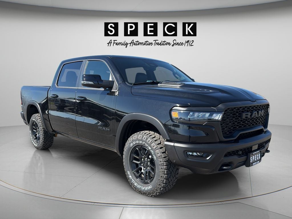 2026 RAM Ram 1500 RAM 1500 REBEL CREW CAB 4X4 5'7' BOX in Diamond Black Crystal Pearl-Coat Exterior Paint — front three-quarter view