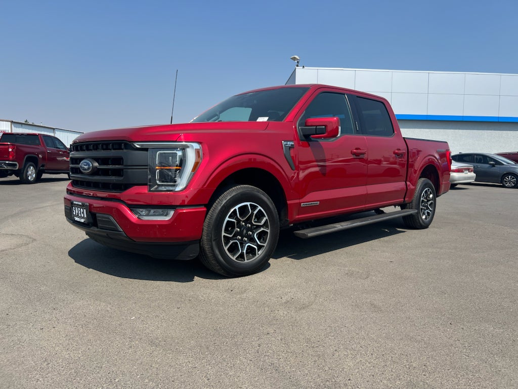 2021 Ford F-150 LARIAT in Rapid Red Metallic Tinted Clearcoat — front three-quarter view