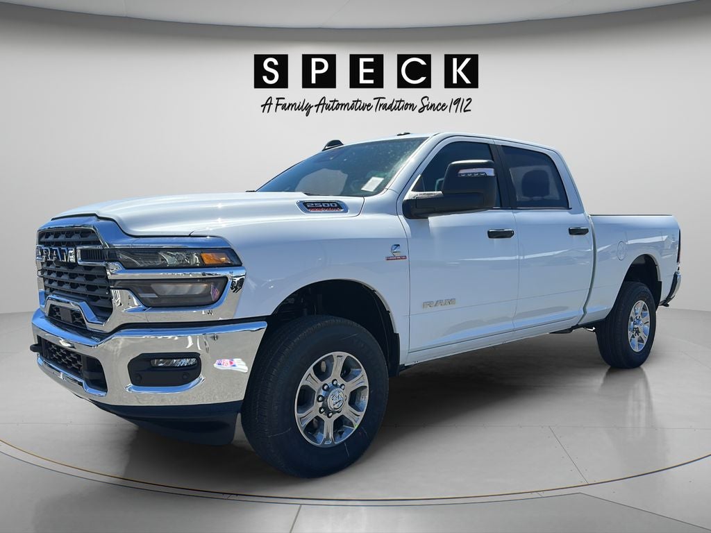 2026 RAM Ram 2500 RAM 2500 BIG HORN CREW CAB 4X4 6'4' BOX in Bright White Clear-Coat Exterior Paint — front three-quarter view
