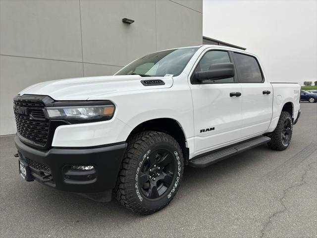 2026 RAM Ram 1500 RAM 1500 WARLOCK CREW CAB 4X4 5'7' BOX in Bright White Clear-Coat Exterior Paint — front three-quarter view